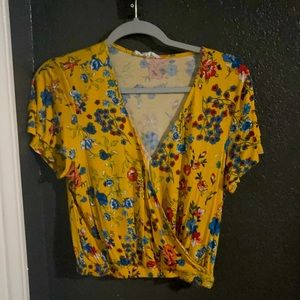 Yellow shirt with multi colored flowers design
